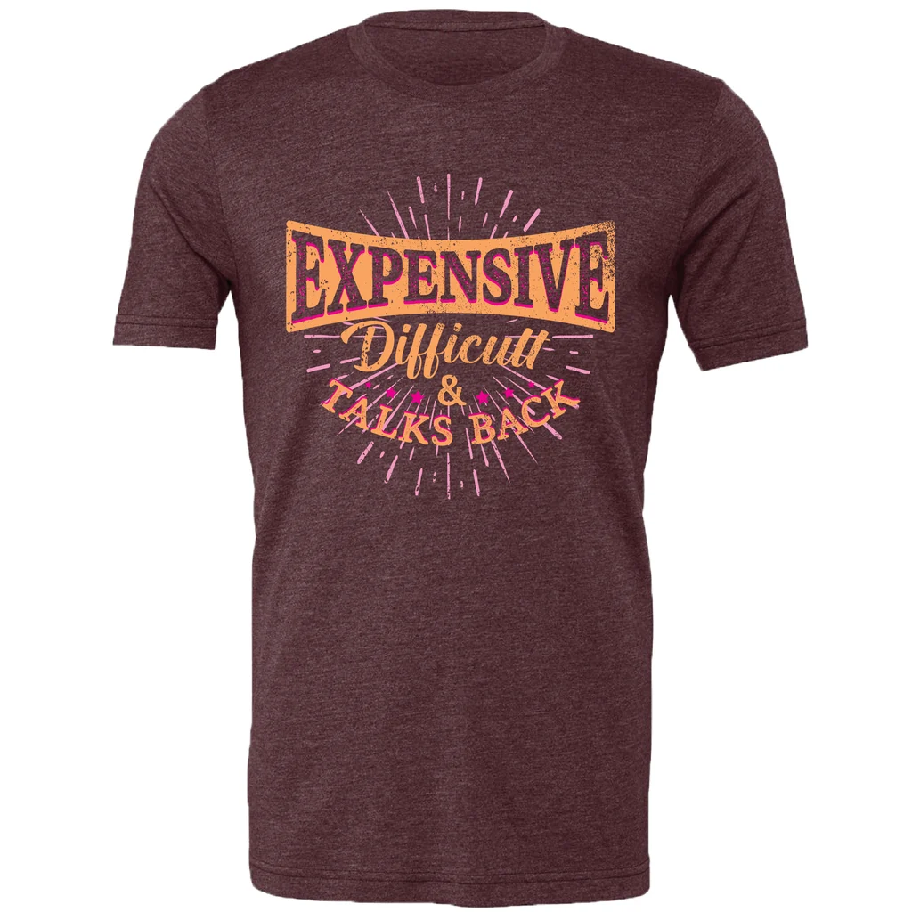 A heathered dark maroon short-sleeve t-shirt with a colorful graphic on the chest that reads 'EXPENSIVE Difficult &amp; TALKS BACK' in orange, yellow, and pink text with a distressed design.