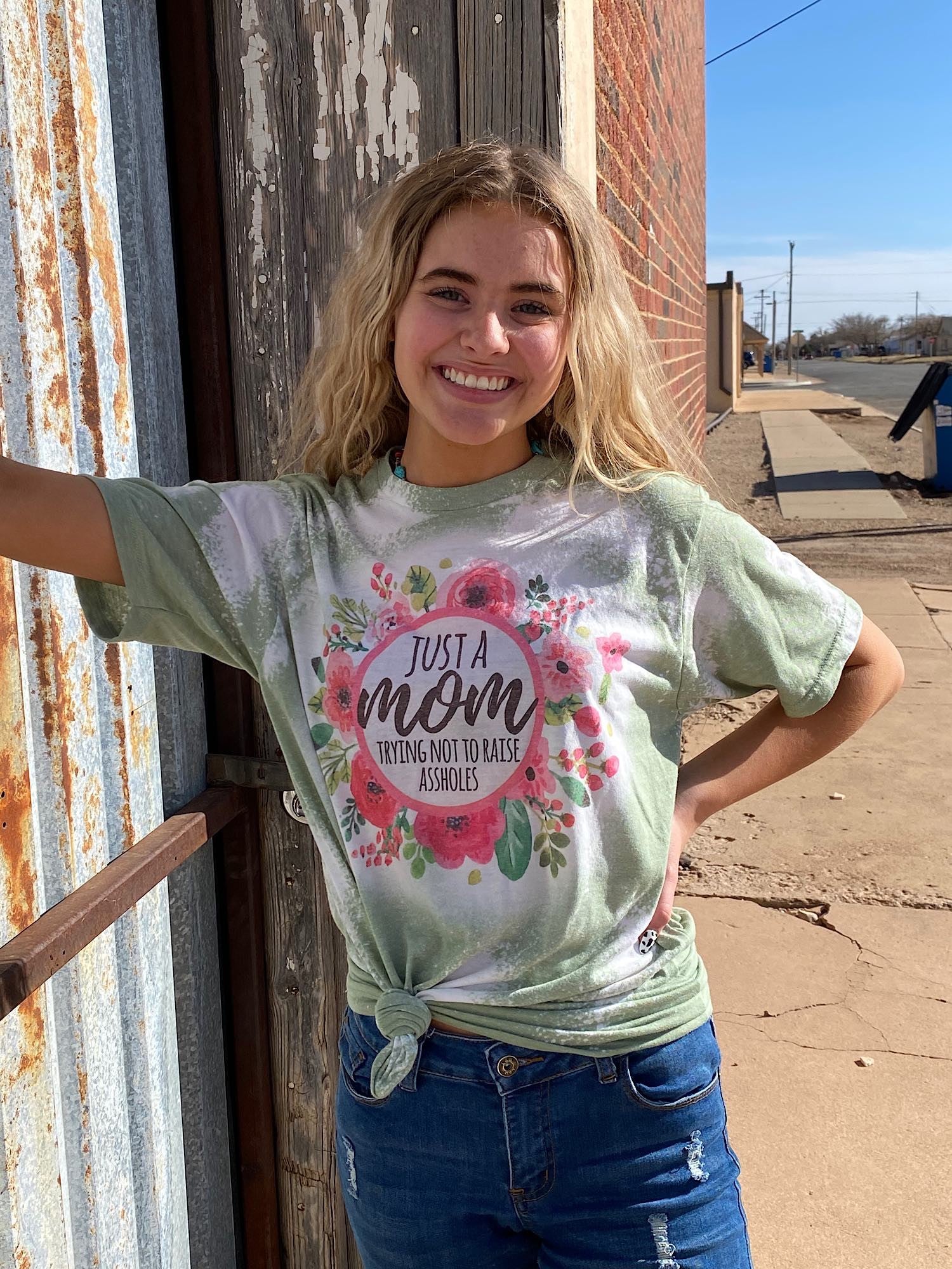 Just a Mom Trying Not to Raise Assholes Bleached Dye Canvas Girlie T Shirt